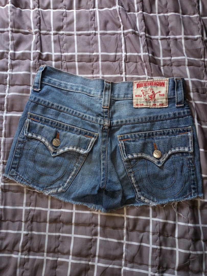 True Religion Denim Shorts (Category: Shorts) located in Manila. Submitted by happylion.79856e (Listing ID 1442748861, Image 1). Description: - Authentic True Religion denim shorts - Classic blue wash - Signature horseshoe stitching on back pockets - Casual frayed hem - Button and zip fly closure - Ideal for summer wear.