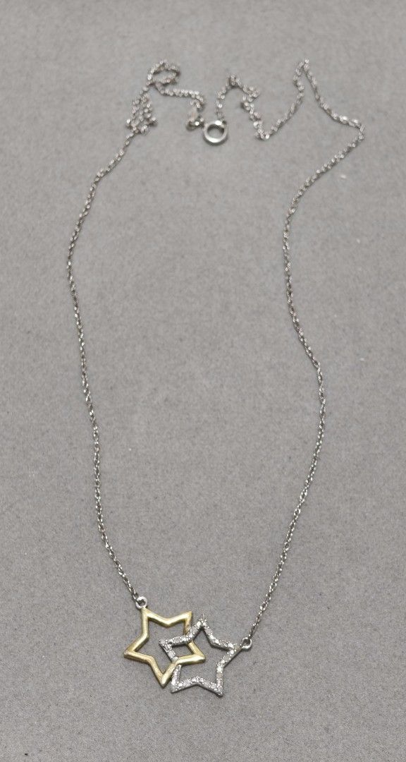 Two-tone Star Necklace with Natural Diamonds (Category: Necklaces) located in Batangas. Submitted by decluttering_bliss (Listing ID 1442836668, Image 1). Description: - Cute necklace with two interlocking stars. - One star is gold-toned, the other is silver-toned with natural diamonds. - Silver-toned chain. - Versatile for everyday wear or a night out. - Adds a touch of sparkle to any outfit..