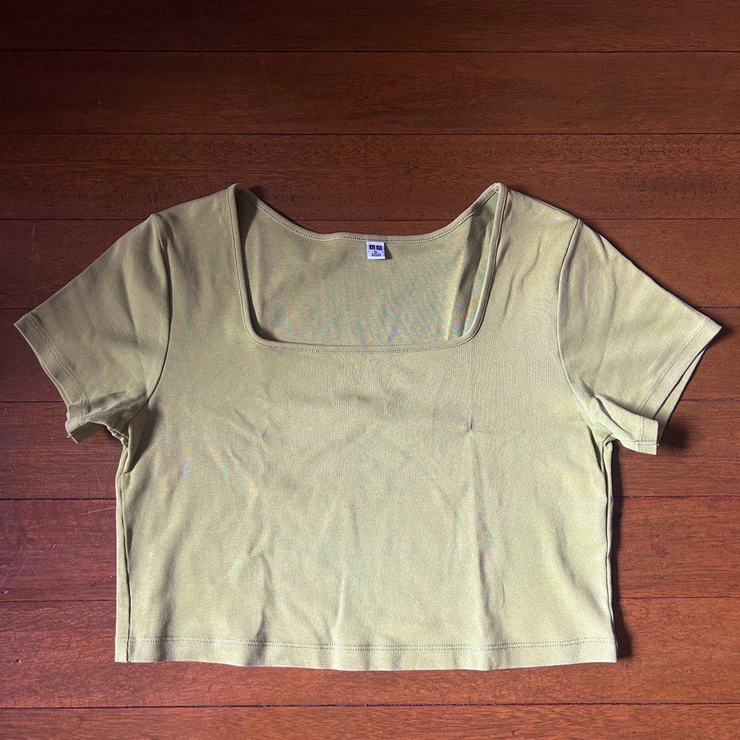 Uniqlo green crop top (Category: Shirts) located in Marikina City. Submitted by talugh (Listing ID 1439932527, Image 1). Description: size - xl color - green i have no idea why its so unsaturated in the picture but i added the real color in the end (this was taken at night with a light above) good as new tags : baby tee, fitted top, ribbed top, basic top, cropped top, stretch top, cotton top, casual top, everyday top, white top, black top, brown 