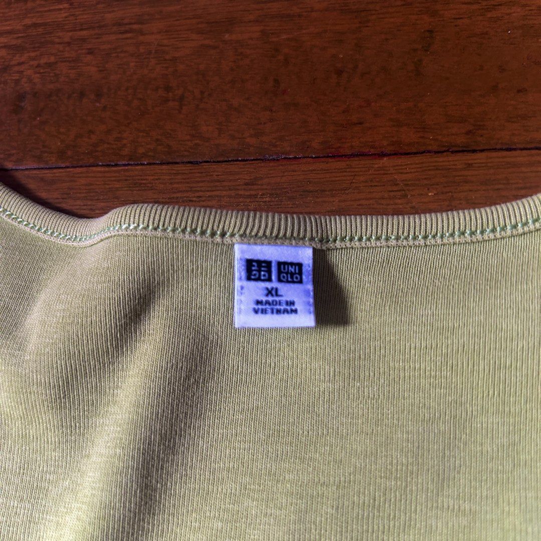 Uniqlo green crop top (Category: Shirts) located in Marikina City. Submitted by talugh (Listing ID 1439932527, Image 3). Description: size - xl color - green i have no idea why its so unsaturated in the picture but i added the real color in the end (this was taken at night with a light above) good as new tags : baby tee, fitted top, ribbed top, basic top, cropped top, stretch top, cotton top, casual top, everyday top, white top, black top, brown 