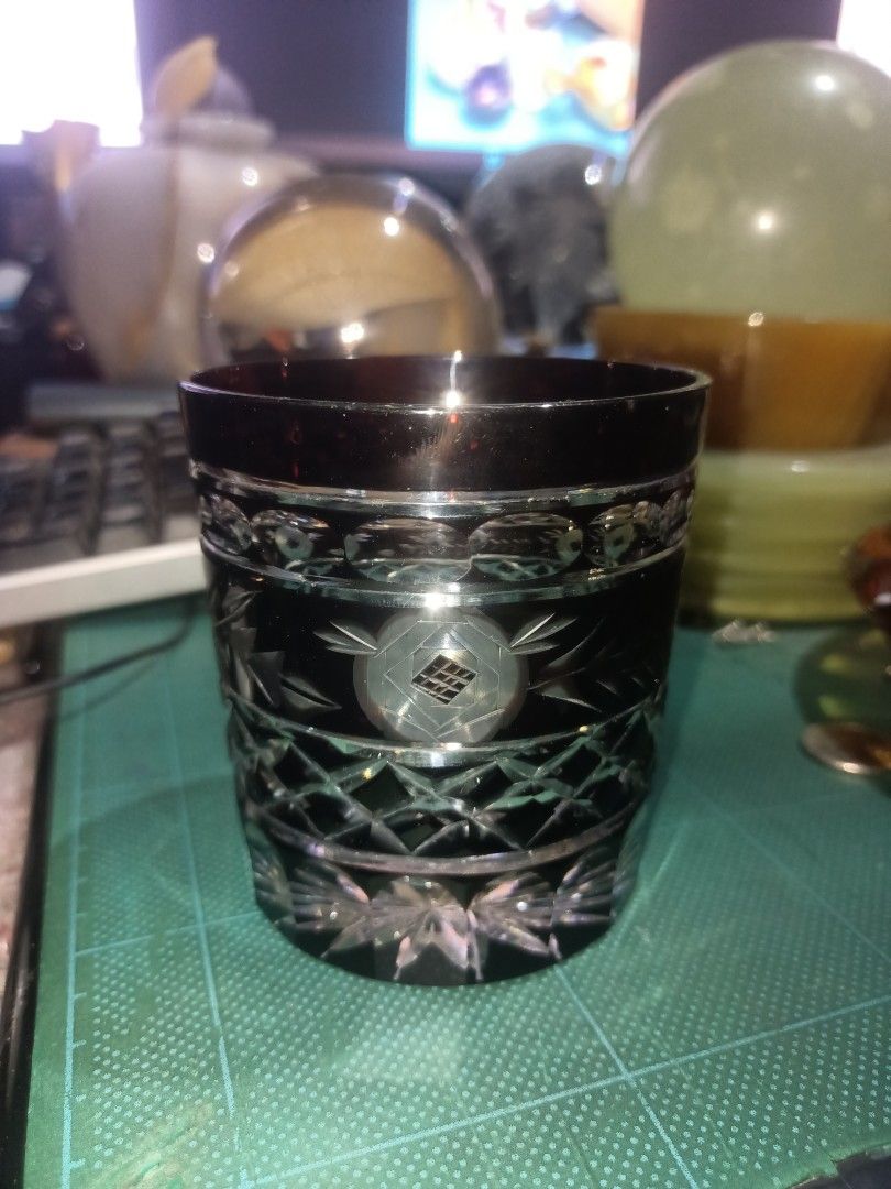 Vintage Edo Kiriko Whiskey Glass (Category: Water Bottles & Tumblers) located in Munoz. Submitted by larryc1212 (Listing ID 1442742254, Image 1). Description: - Beautiful dark amber cut glass tumbler. - Features intricate geometric and floral etched patterns. - Starburst design on the base. - Ideal for whiskey or any beverage. - Adds sophistication to your barware. - Approximately 4 inches tall. .
