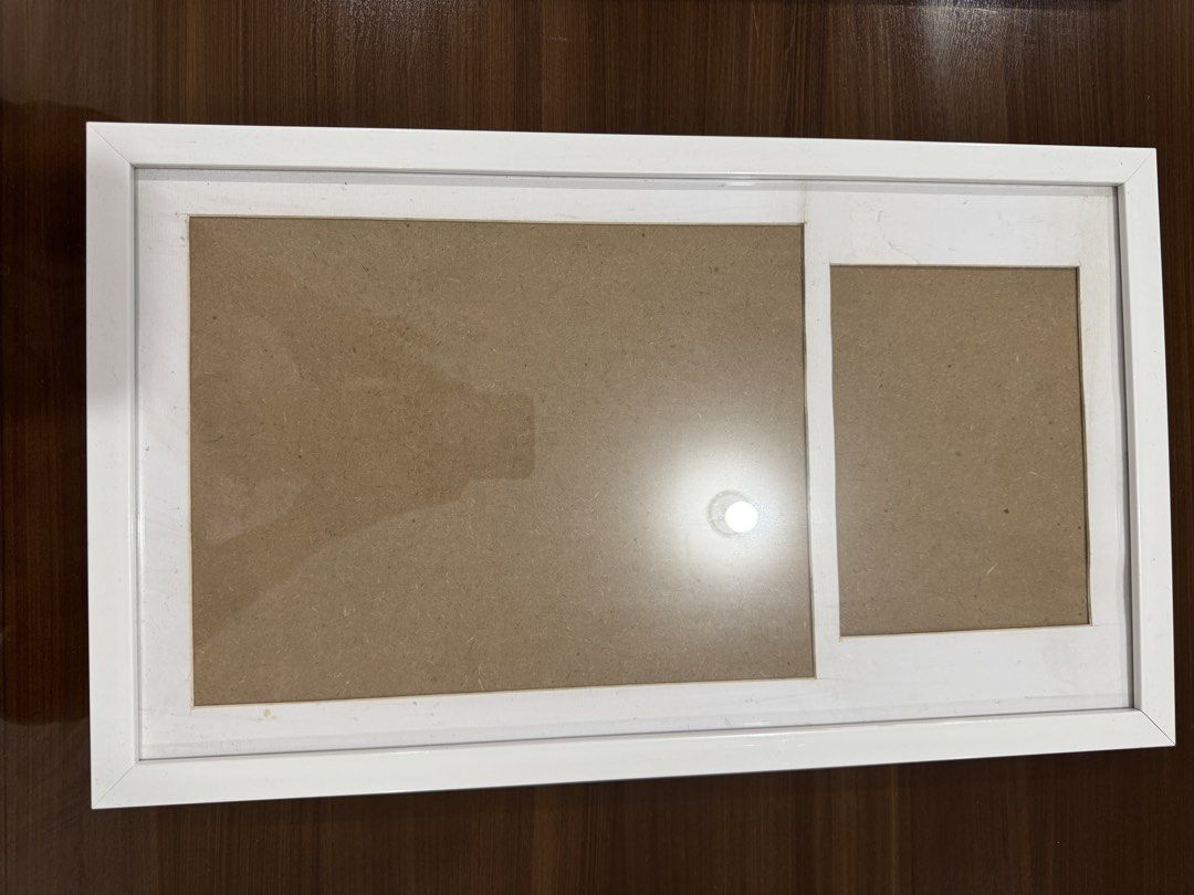 White Double Photo Frame (Category: Frames & Pictures) located in San Juan City. Submitted by kc053192 (Listing ID 1442744982, Image 1). Description: - For 5R Grad Pic and Certificate - White photo frame - Two openings: one large, one smaller square - Ideal for displaying memories - Simple and clean design - Fits most home decor styles - Ready to be filled with your favorite pictures.