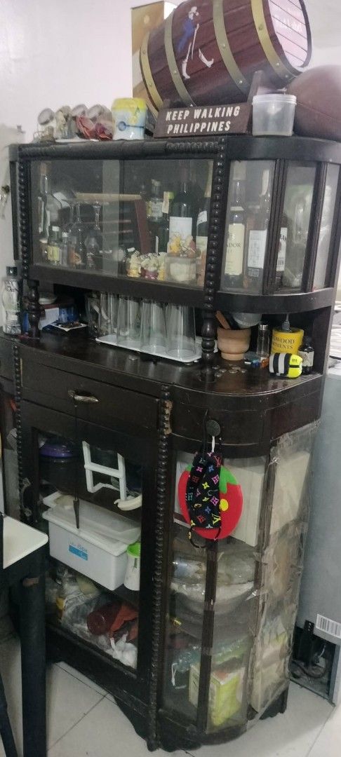 Wooden Display Cabinet, Dining Set, and Sofa (Category: Other Home Furniture) located in Rodriguez. Submitted by swiftwolf-dfd7eb (Listing ID 1442755048, Image 1). Description: with free drawer or aparador - Tall wooden display cabinet with glass doors - Dining table with 4 black chairs - Beige three-seater sofa - Perfect for living or dining areas.