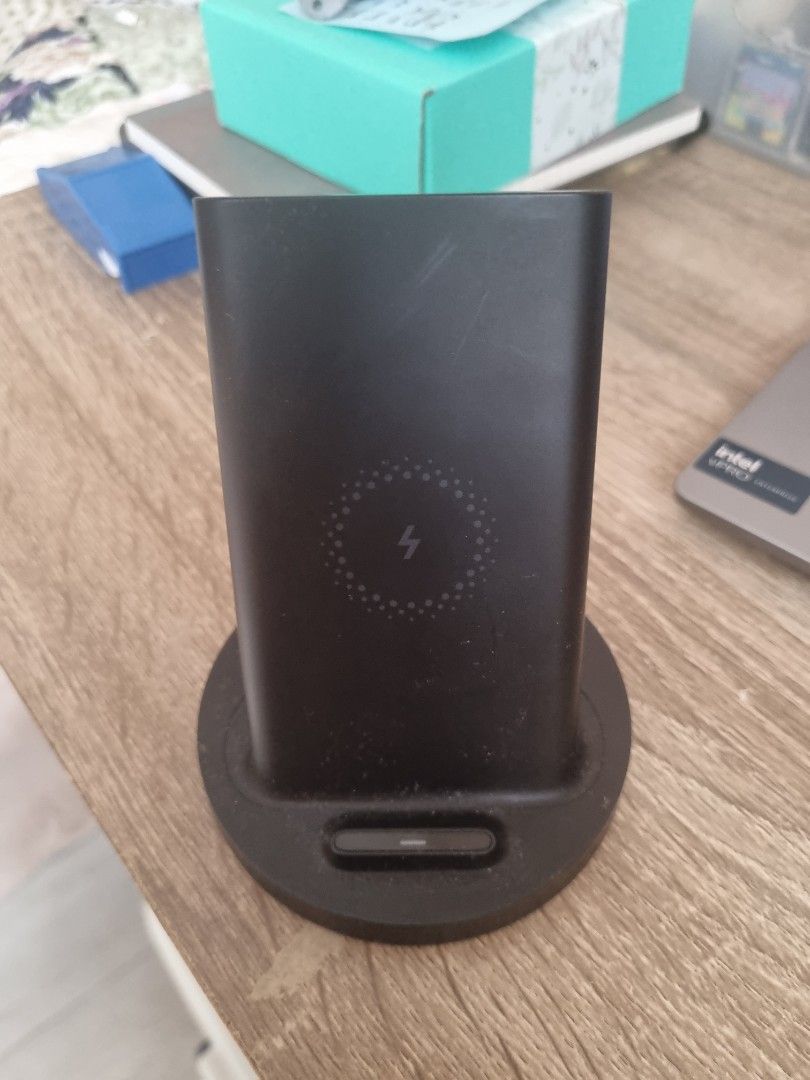 Xiaomi Wireless Charger Stand (Category: Chargers & Cables) located in Quezon City. Submitted by halylauren (Listing ID 1442751658, Image 1). Description: - Xiaomi Wireless Charging Stand - Color: Black -20W output - Distinctive lightning bolt symbol on top - Fully functional and works well - Selling due to no longer being used - Perfect for convenient charging on your desk.