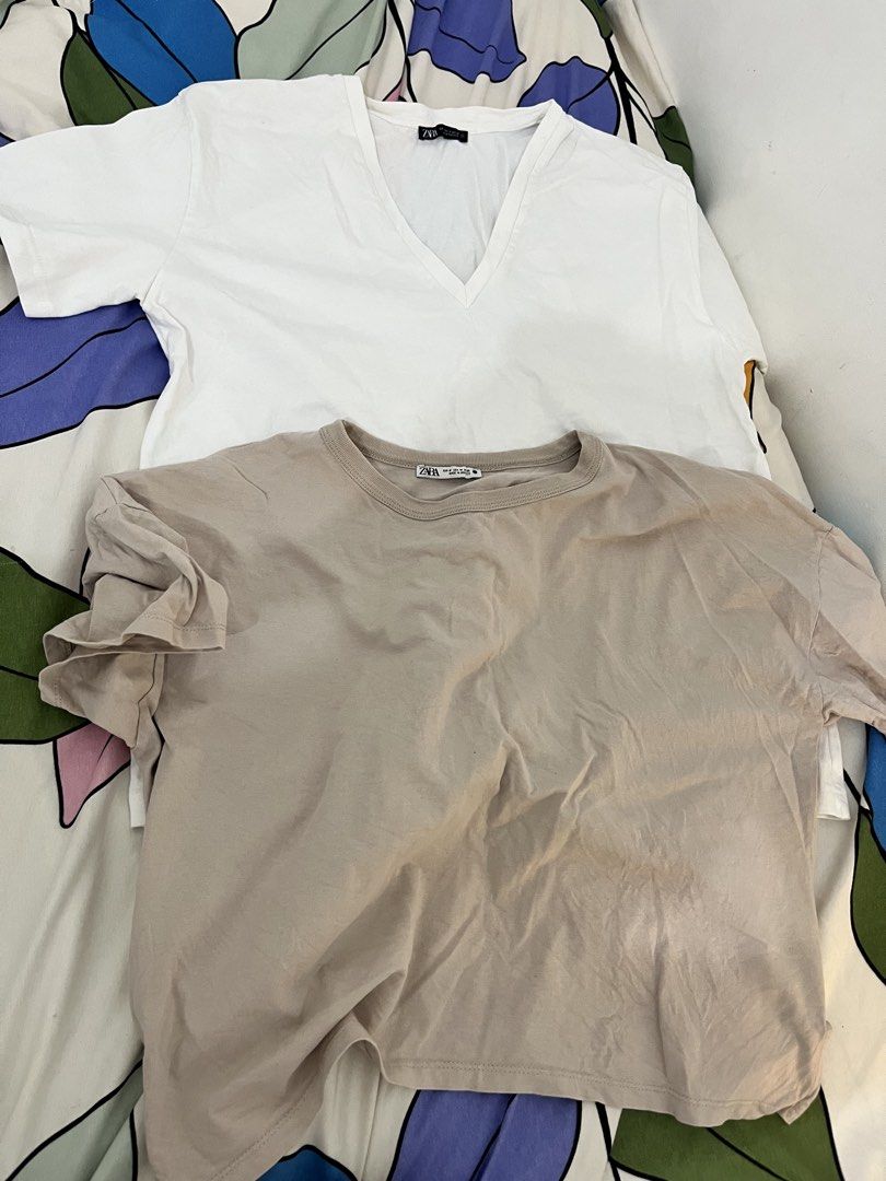 Zara Basic T-Shirts Bundle (White V-Neck, Beige Crew Neck) (Category: Shirts) located in Quezon City. Submitted by classychicph92 (Listing ID 1442884599, Image 2). Description: - Bundle of two Zara basic tops - Includes a white V-neck tee - Includes a beige crew neck tee - Comfortable and versatile for everyday wear - Great for layering or wearing solo - Easy to mix and match.
