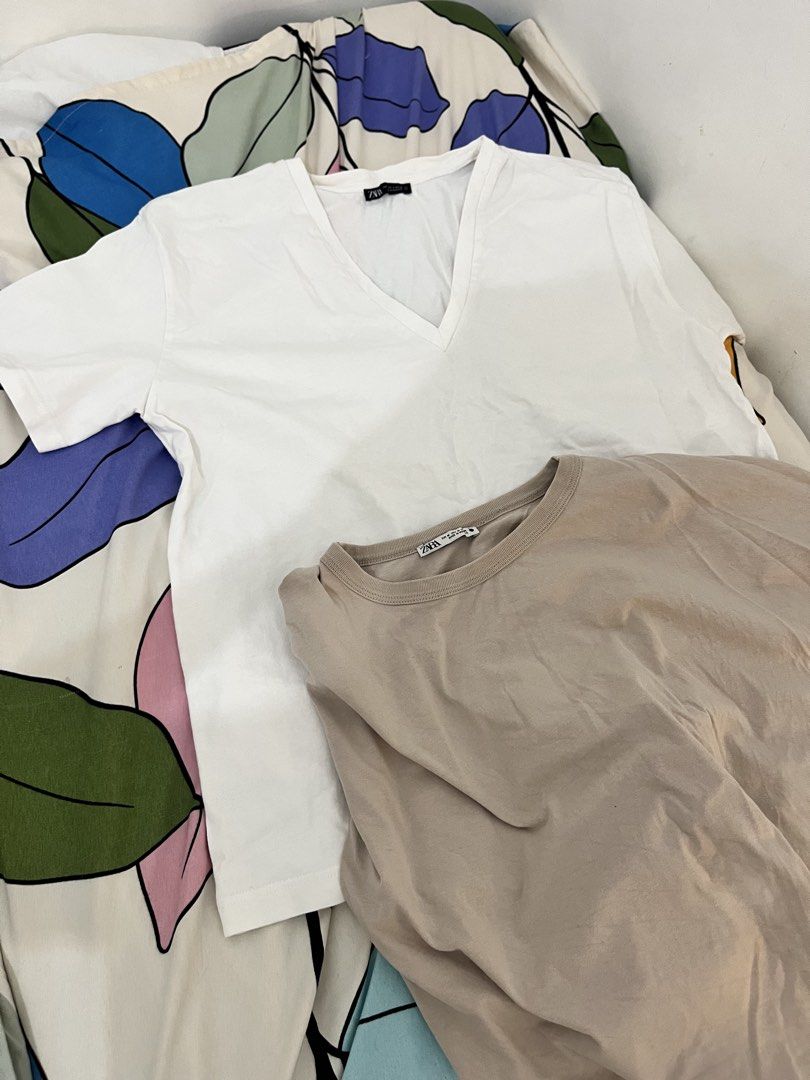 Zara Basic T-Shirts Bundle (White V-Neck, Beige Crew Neck) (Category: Shirts) located in Quezon City. Submitted by classychicph92 (Listing ID 1442884599, Image 3). Description: - Bundle of two Zara basic tops - Includes a white V-neck tee - Includes a beige crew neck tee - Comfortable and versatile for everyday wear - Great for layering or wearing solo - Easy to mix and match.