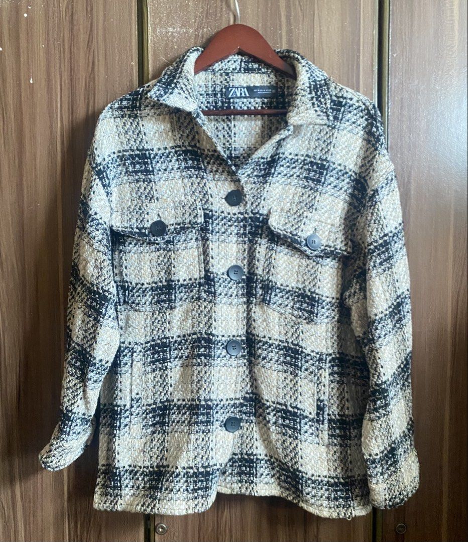 ZARA Checked Tweed Overshirt Jacket Beige Black (Category: Coats, Jackets and Outerwear) located in Quezon City. Submitted by ysabellashoppe (Listing ID 1442849885, Image 3). Description: - Oversized checked jacket from Zara - Textured tweed fabric in beige and black - Button-up front with two chest pockets - Versatile for layering over tees or turtlenecks - Perfect for a casual, chic look.