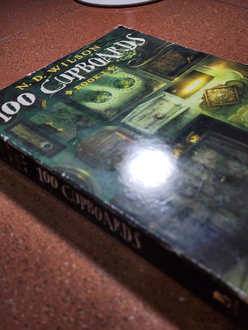 100 Cupboards Book 1 by N.D. Wilson (Category: Children's Books) located in Manila. Submitted by axis09 (Listing ID 1446920925, Image 3). Description: - 100 Cupboards, Book 1 by N.D. Wilson - First book in the series - Genre: Fantasy Adventure - Paperback Edition - Ideal for young readers - Features magical journeys - Great for your next read.