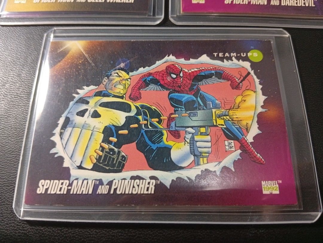 1992 Marvel Universe Spiderman Team Ups Card Set (Category: Raw Singles) located in Manila. Submitted by back_to_the_thrift (Listing ID 1446999237, Image 2). Description: Set of 3 spiderman team ups All are in toploader and sleeves cards are not mint this is vintage card. still good surface card. .