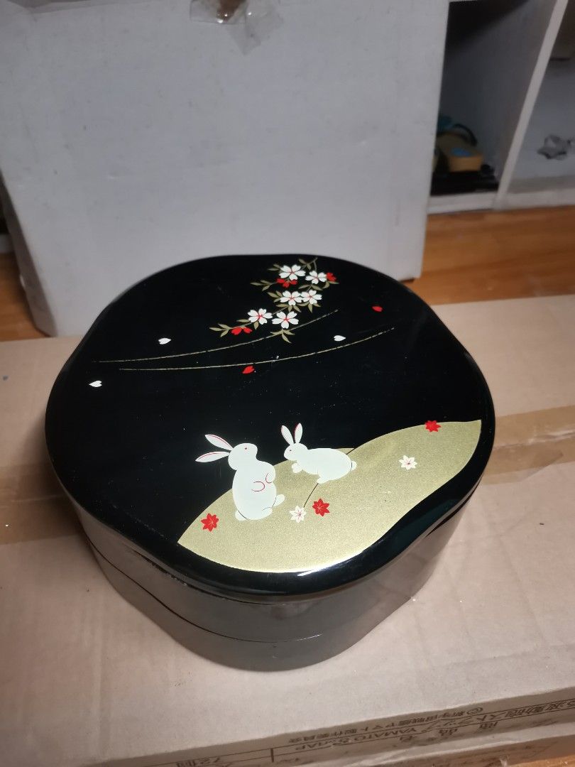 2 tier Japanese Jubako box (Category: Dinnerware & Cutlery) located in Marikina City. Submitted by cheaponsales (Listing ID 1447072013, Image 1). Description: not used but some viaible scratches on closer look from storage... A Jubako (重箱) is a traditional, multi-tiered Japanese box used for storing, transporting, and serving food. Usually featuring two to four stackable layers and a lid, these decorative boxes—often finished with elegant lacquer