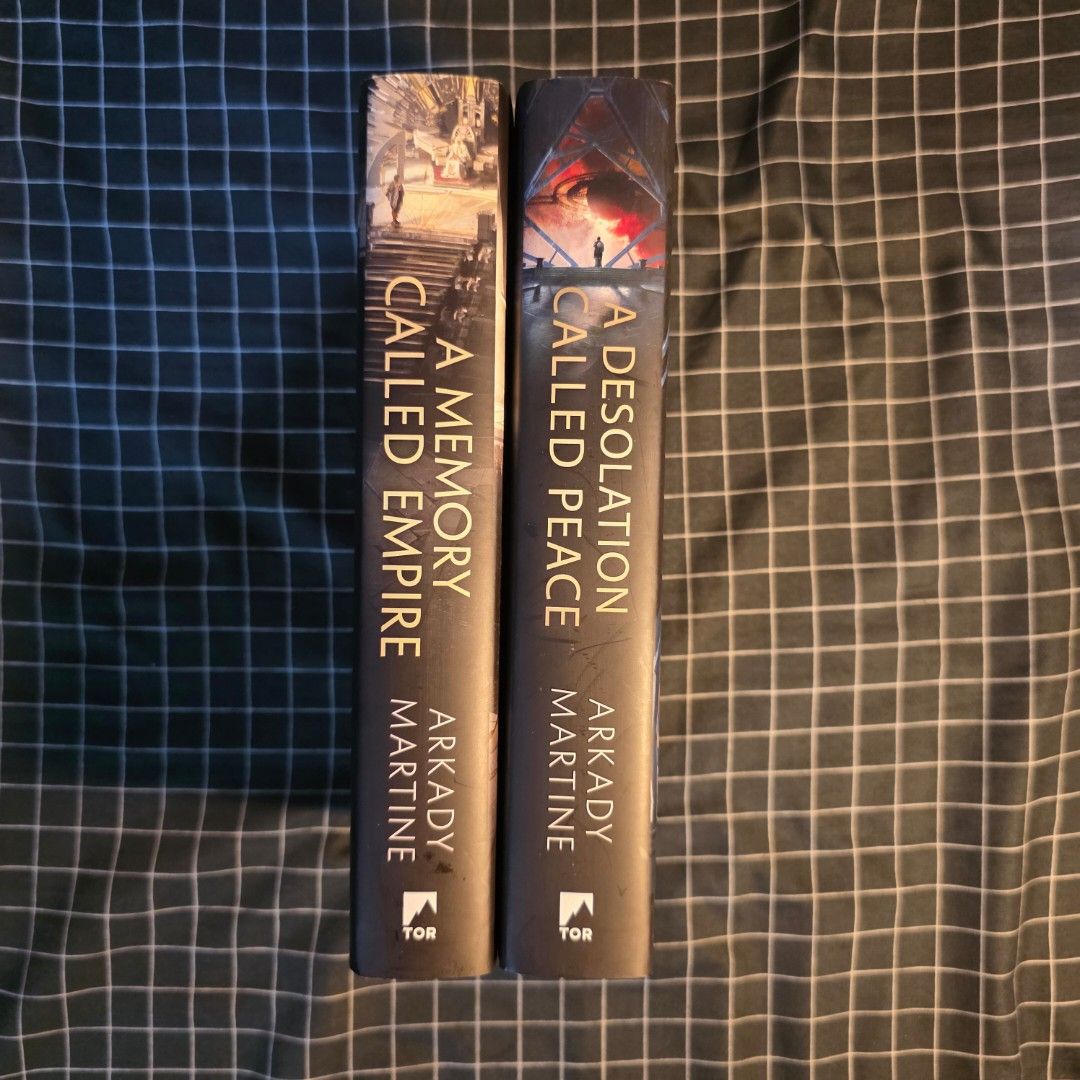 A Memory Called Empire & A Desolation Called Peace by Arkady Martine (Category: Storybooks) located in Carmona. Submitted by demonfog (Listing ID 1447017361, Image 2). Description: - Selling Arkady Martine's 'A Memory Called Empire' and 'A Desolation Called Peace'. - Both are hardcover editions. - Highly acclaimed sci-fi novels. - Ideal for fans of space opera and political intrigue. - Grab both for your next exciting read!.