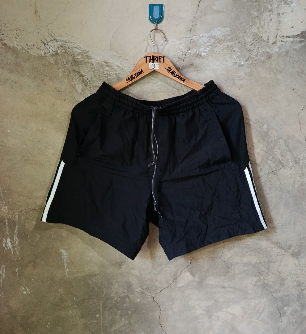 Adidas Black Shorts with White Stripes (Category: Activewear) located in Kalamansig. Submitted by skone1996 (Listing ID 1446970746, Image 1). Description: - Classic black Adidas shorts - Small size - 30-32 Waistline - 16 Length - 9.8/10 Color rate - Issue Last pic. nabura na ang logo pero solid parin pang takbo - Features iconic white three stripes on the side - Elastic waistband with adjustable drawstring for a perfect fit - Versatile for sports