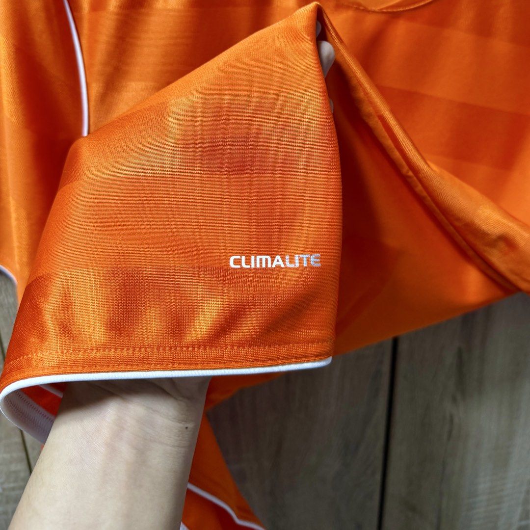 Adidas Climalite Soccer Jersey (Category: Activewear) located in Taguig. Submitted by cee.declutters (Listing ID 1447099695, Image 3). Description: Adidas Climalite Soccer Jersey Orange/ White Preloved S on tag 26”x18” Faded/ peeled off back print Shipping from Pangasinan SF at buyer’s expense .
