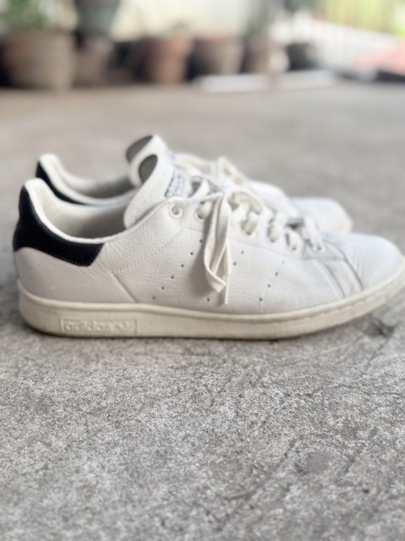 Adidas Stan Smith White Black Leather Sneakers (Category: Sneakers) located in Caloocan City. Submitted by koshi_gem (Listing ID 1446972122, Image 1). Description: - Classic Adidas Stan Smith sneakers - Color: White leather with black heel tab - Size: US 10.5 - Made in India - Shows some signs of wear on sole and leather - Great for everyday wear - Please check photos for detailed condition.
