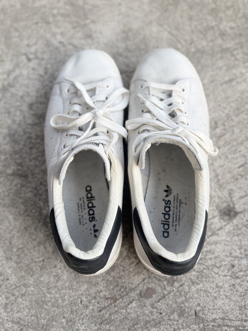 Adidas Stan Smith White Black Leather Sneakers (Category: Sneakers) located in Caloocan City. Submitted by koshi_gem (Listing ID 1446972122, Image 2). Description: - Classic Adidas Stan Smith sneakers - Color: White leather with black heel tab - Size: US 10.5 - Made in India - Shows some signs of wear on sole and leather - Great for everyday wear - Please check photos for detailed condition.