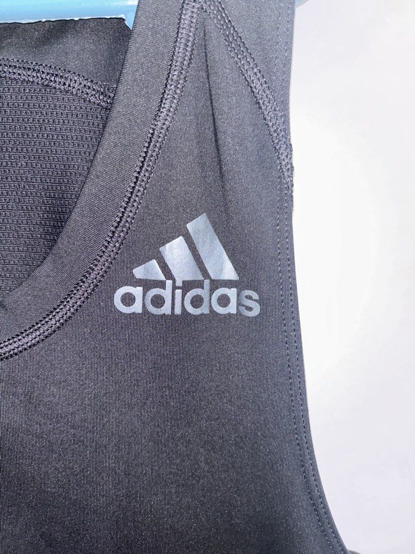 Adidas Techfit Compression Tank Top Men's Size L Black (Category: Activewear) located in Pasig City. Submitted by timmybatoon (Listing ID 1446979763, Image 3). Description: Adidas Techfit Compression Tank Top Size on tag: L Dimensions: 15.5inW x 27.5inL Price: 600 - Black Adidas Techfit compression tank top - ClimaCool fabric for enhanced breathability - Ideal for workouts and sports activities - Size: Large - Condition: Good.