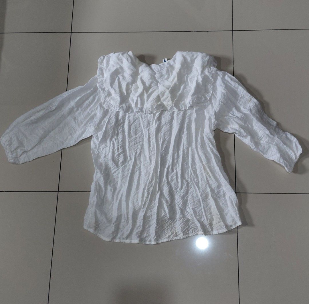 Baby Doll White Coquette Button-Up Blouse (Category: Blouses) located in Manila. Submitted by niknacks_ (Listing ID 1446924769, Image 2). Description: 🛍 INFO: - baby doll / coquette button up polo - can fit S-L - rfs: declutter - notice: manage expectations + few stains, but will wash before shipping - pm for more deets 📦 MOP & MOD: - transfer through QR InstaPay (GCash, Maya, etc) - payment first, no return / refund - lalamove or j&t (booked b