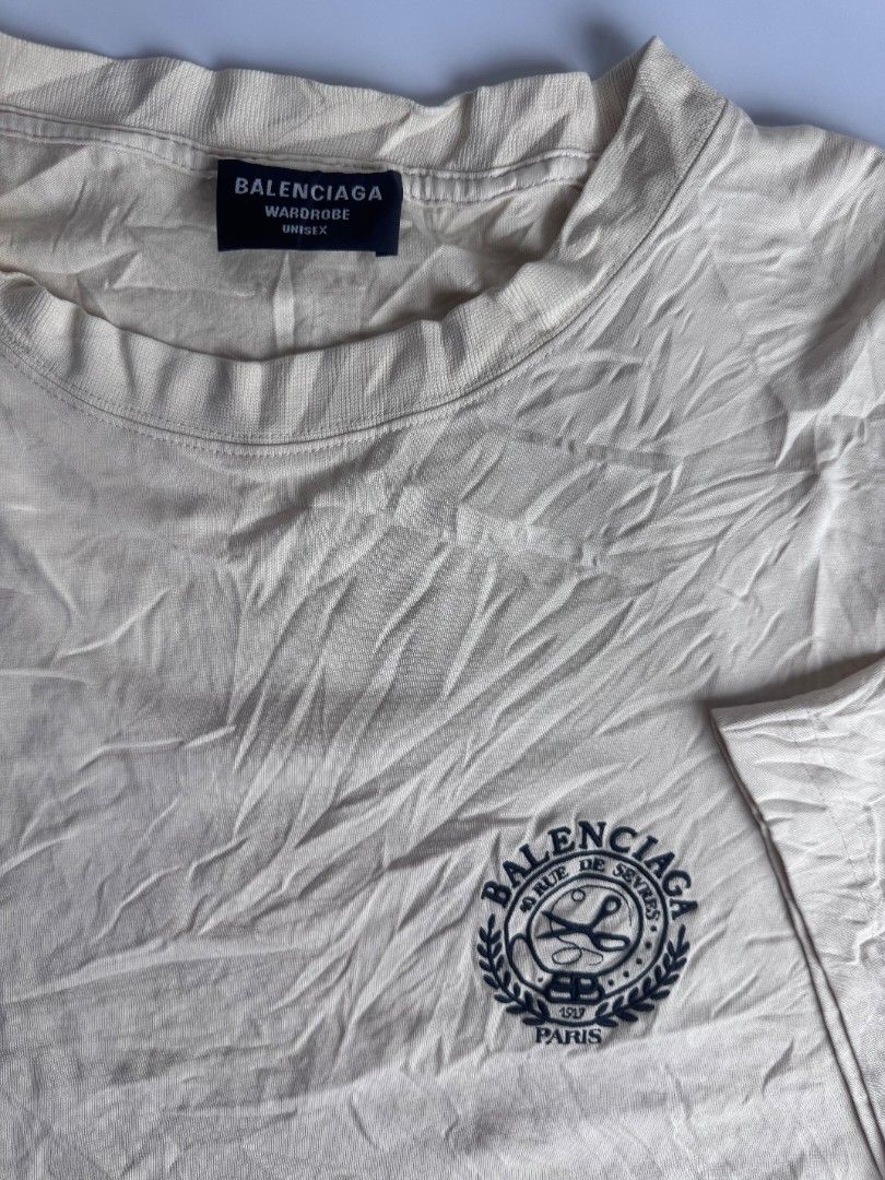 Balenciaga (Authentic) (Category: Tshirts & Polo Shirts ) located in Baguio. Submitted by labelleferroniere (Listing ID 1447077710, Image 2). Description: - Authentic Balenciaga Paris T-shirt - Color: Cream - Size: Medium (M) - Made in Portugal - Features iconic Balenciaga logo on chest - Ideal for casual and everyday wear.