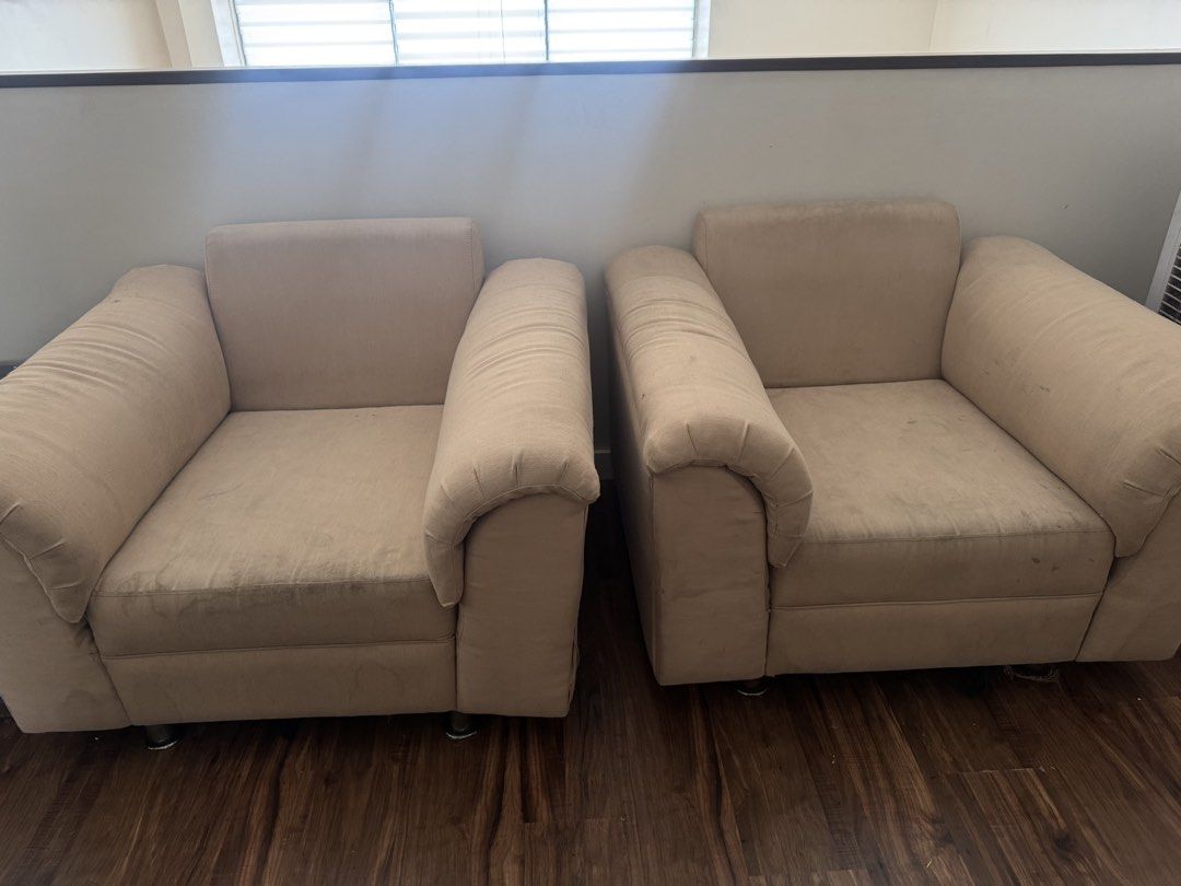 Beige Armchair - Single Seat Sofa (Category: Chairs) located in Manila. Submitted by rockypeach (Listing ID 1446915018, Image 2). Description: 1,500 per piece, 2,500 take both - Beige single-seat armchair - Upholstered in soft fabric - Shows wear and tear, particularly on arms and underside - Large tear on the back exposing internal springs - Still functional, but requires repair - Ideal for DIY projects or spaces where condition is not a primary