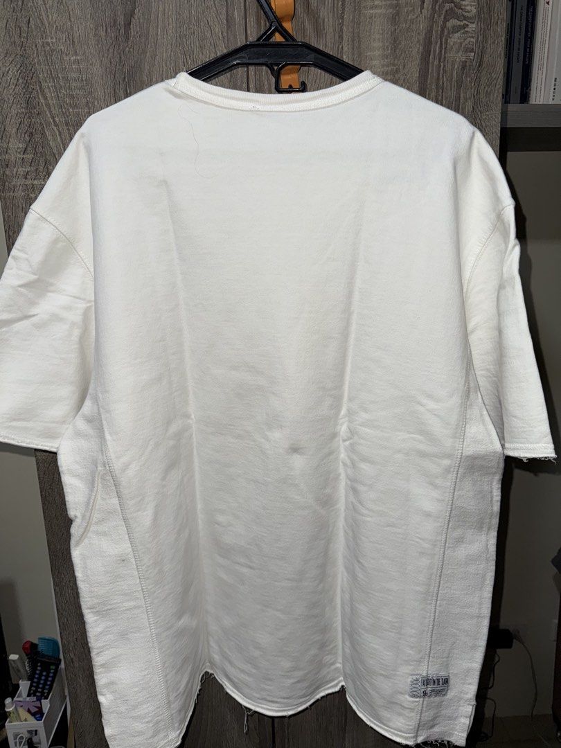 Bershka White Oversized T-Shirt (Category: Tshirts & Polo Shirts ) located in Mandaluyong City. Submitted by getamplifiednow (Listing ID 1446940446, Image 2). Description: - White oversized t-shirt - Fits like a size L or XL - Features stitching details on sides and hem - Small stain on the front (see last pic) - Ideal for casual everyday wear.