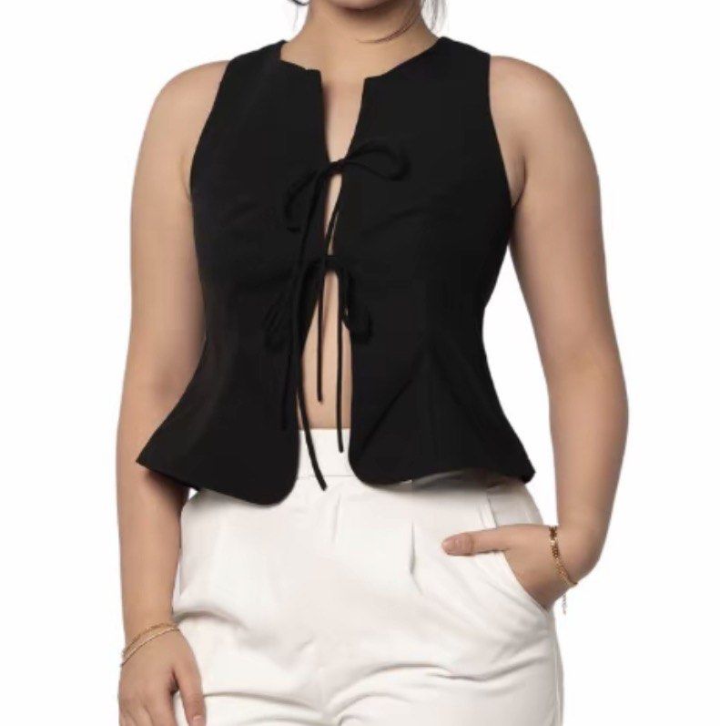 Black Sleeveless Tie-Front Peplum Top (Category: Sleeveless) located in Manila. Submitted by eunicemarzan (Listing ID 1446973437, Image 2). Description: USED ONCE! Size: L (fits M-L) .