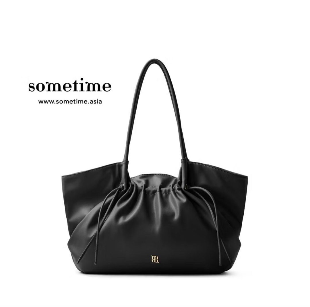 Black Sometime Mandu Shoulder Bag (Big) (Category: Tote Bags) located in Kajang. Submitted by myrapika (Listing ID 1447043550, Image 1). Description: - Brand: Sometime - Material: Black Leather - Style: Tote Bag - Closure: Gathered top with drawstring - Straps: Two shoulder straps - Interior: Gold logo detail - Features: Spacious, ideal for daily essentials.