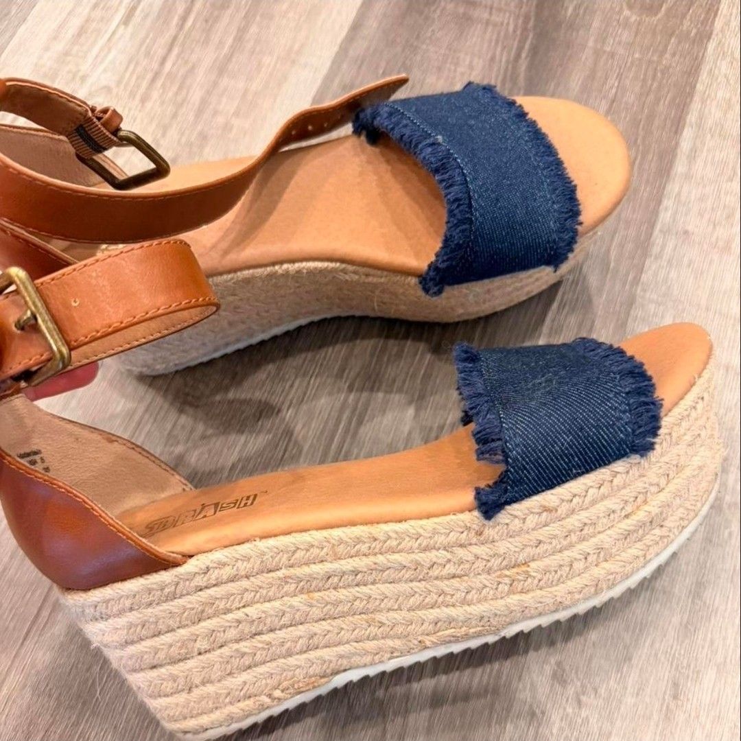 Brash Denim & Espadrille Wedge Sandals (Category: Wedges) located in Pasig City. Submitted by chinitafrommanila (Listing ID 1447099467, Image 1). Description: Brash ( fr USA) condition is lightly used but with cleaning it can look good as new - Cute wedge sandals - Denim front straps & tan ankle straps. SO FUN AND QUIRKY! :) - Espadrille sole - Size: 5 US but fits 5.5, maybe even 6 - Perfect for summer outfits - Comfortable wedge heel for easy wa