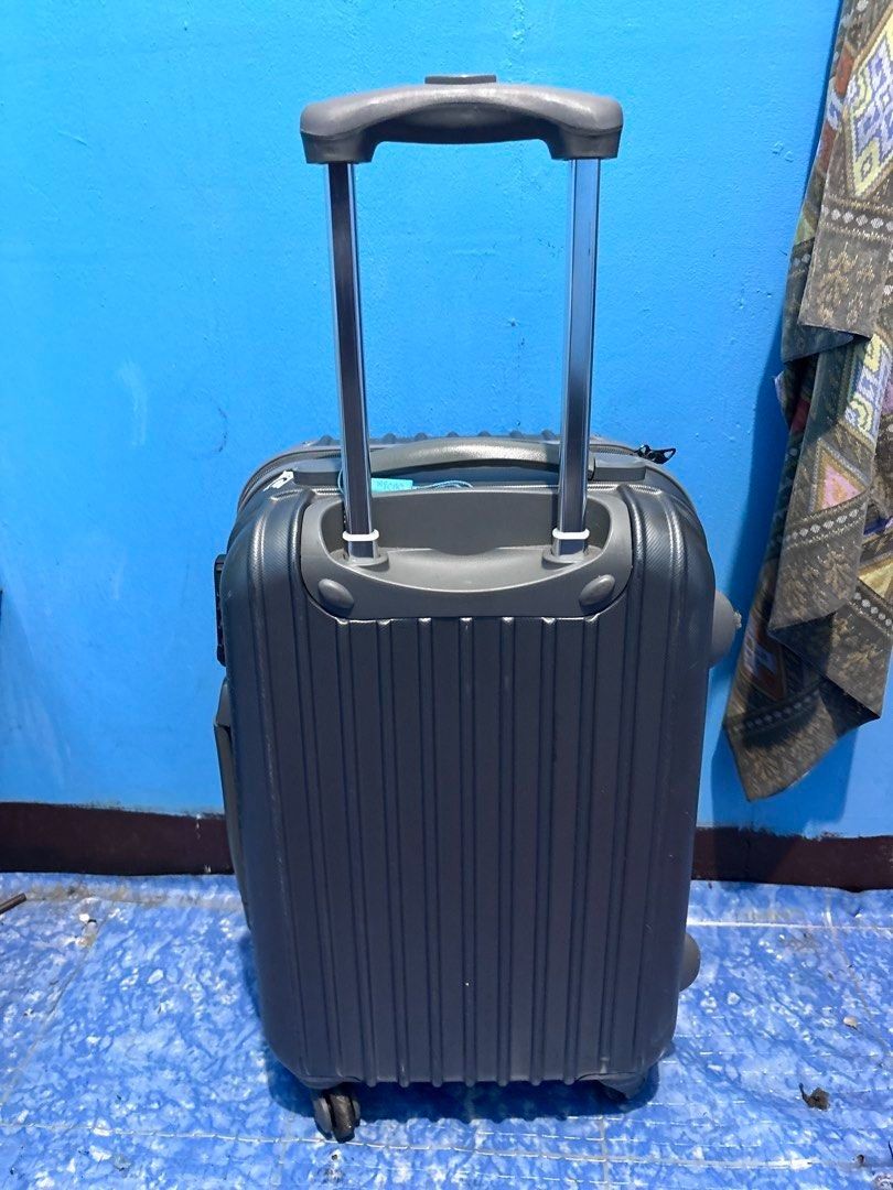 Ferie Grey Hardshell Cabin Luggage with TSA Lock (Category: Luggage) located in Manila. Submitted by offtherack_mnl (Listing ID 1446931121, Image 2). Description: - Grey hardshell cabin luggage - Built-in TSA lock for security - Interior straps to keep belongings in place - Smooth-gliding 4-wheel spinner system - Ideal for short trips and carry-on use - Note: Minor scuffs on wheels due to normal use - 50% of the sales will help and support cancer