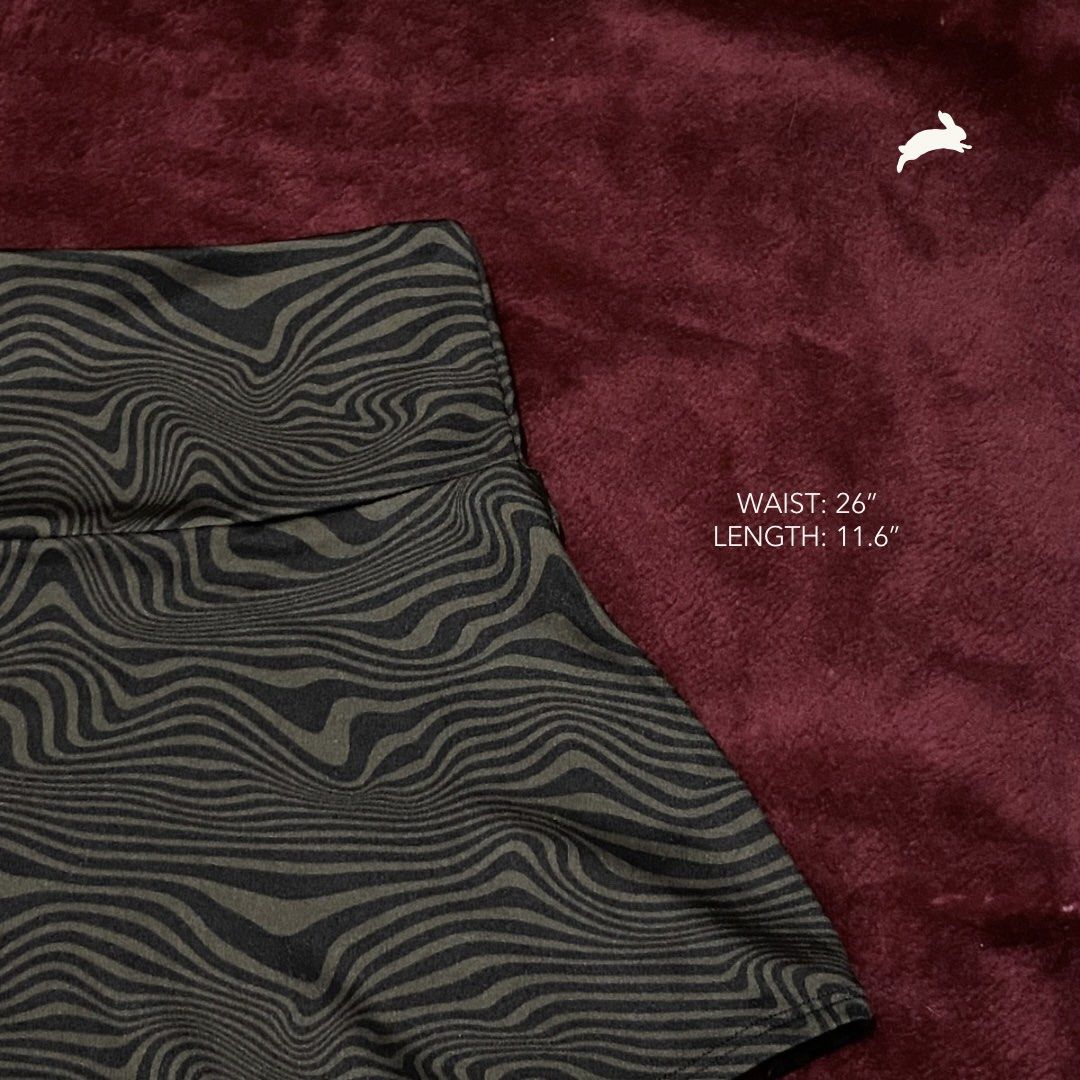 Brown Psychedelic Swirl Print Mini Skirt (Category: Skirts) located in Manila. Submitted by kitsune.ph (Listing ID 1447021828, Image 2). Description: ⤷ brand: h&m ⤷ waist: 26” length: 11.6” ⤷ mop: gcash/maribank/bpi ⤷ j&t express ⤷ same day delivery (lalamove, grab, etc.) ig & carousell: kitsune.ph 🐇.