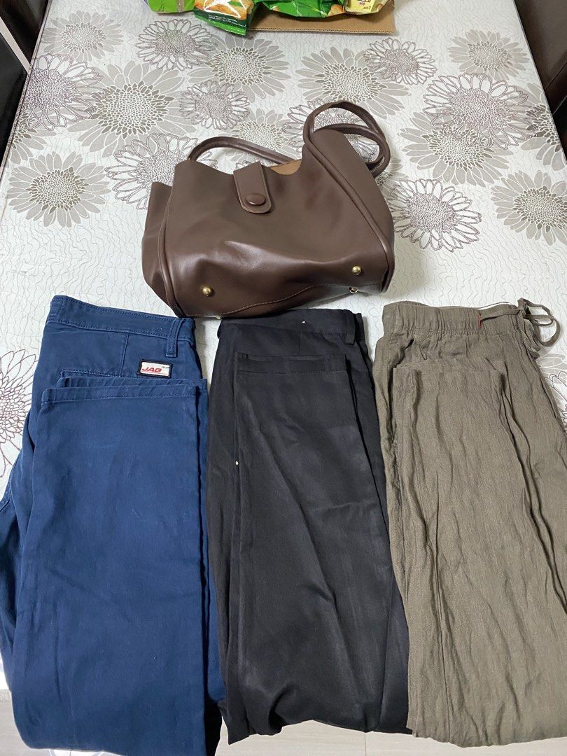 Brown Tote Bag & JAG Jeans Bundle (Category: Tote Bags) located in Manila. Submitted by simple_ideas (Listing ID 1447021512, Image 1). Description: - Classic brown tote bag with secure button closure. - Blue JAG jeans, size 28, featuring stylish red stitching. - Versatile black pants. - Casual khaki pants. - Ideal bundle for everyday wear and easy styling. Bundled item di na ginagamit size range ng jeans 28-29.