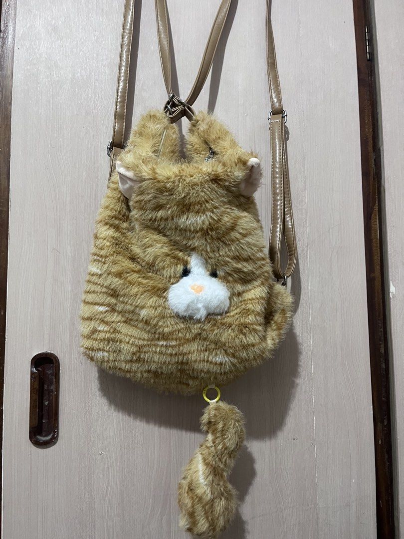 Cat plush shoulder bag backpack | free shipping (Category: Shoulder Bags) located in Iloilo. Submitted by youronlinesister (Listing ID 1447050661, Image 2). Description: Cute cat plush bag convertible Pwede crossbody | shoulder bag and backpack So fluffy Light weight Spacious Flaw: tinahi ko ung straps sa body ng bag Kase para syang mapipigtas , patahi nyo na lang sa may sewing machine para pulido Price:P380 free shipping via J&T Mop: gcash .