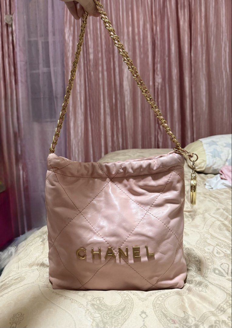 Chanel 22 Bag (Category: Luxury Bags & Wallets) located in Las Pinas. Submitted by closethaulsph (Listing ID 1447034230, Image 1). Description: -microchip - Quilted Leather with Gold Hardware - Features iconic Chanel logo in gold - Gold chain strap and Long body strap inside - Drawstring closure - Note: Minor scuffs , stains and signs of use present on leather, particularly on the bottom and sides as well as on the inside..