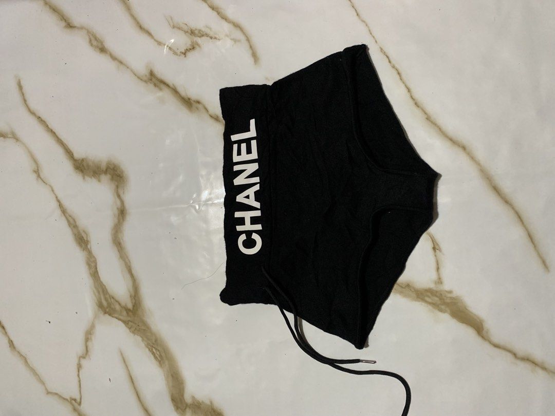 Chanel Black Shorts with Logo Waistband (Category: Luxury Apparel) located in Iloilo. Submitted by johnpullan30303 (Listing ID 1447076607, Image 1). Description: - Authentic Chanel black shorts - Features iconic Chanel logo on elastic waistband - Drawstring closure for adjustable fit - Made from comfortable fabric - Ideal for lounging or casual wear.