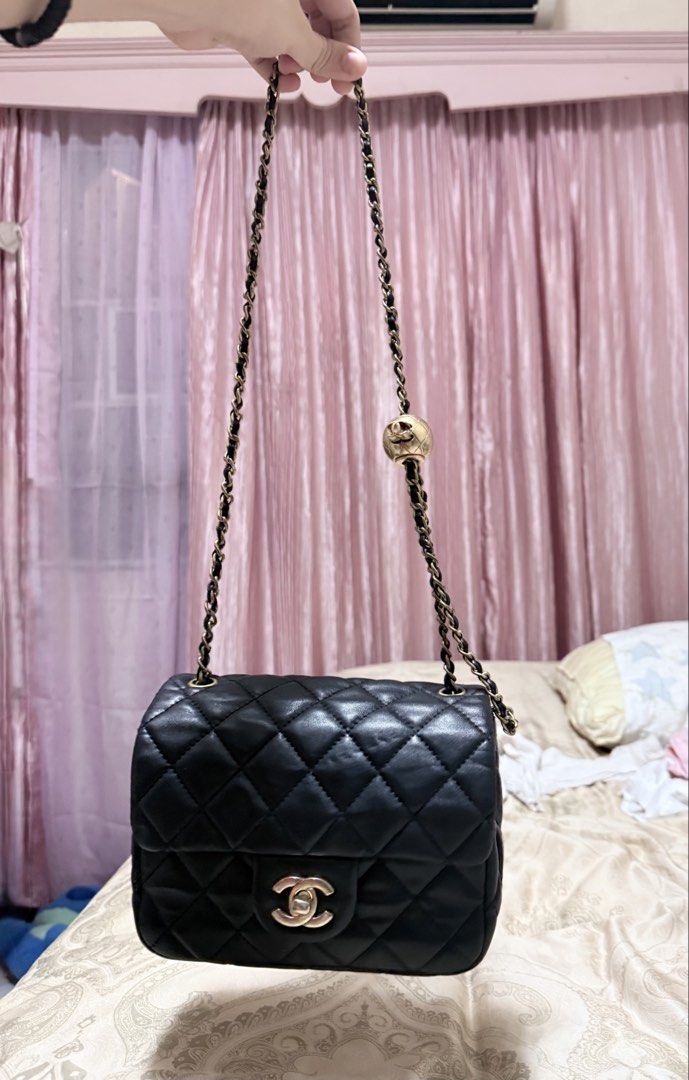 Chanel Pearl Crush Flap (Category: Luxury Bags & Wallets) located in Las Pinas. Submitted by closethaulsph (Listing ID 1447031866, Image 2). Description: coded negative screw Heavy pearl -For this specific model, the zipper hardware does NOT typically have a CC stamp underneath the slider/pull mechanism. Classic black quilted leather flap bag - Iconic Chanel CC logo clasp - Gold chain strap with unique ball charm detail - Lined gold interior with