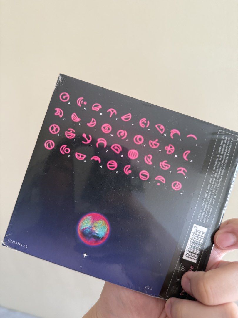 Coldplay x BTS My Universe CD (Category: CDs & DVDs) located in Mandaluyong City. Submitted by getamplifiednow (Listing ID 1446938802, Image 2). Description: - Brand New: Coldplay x BTS 'My Universe' CD, still sealed in original plastic. - Unique Cover Art: Features a cool cosmic design with pink symbols. - For the Fans: A must-have collectible for any Coldplay or BTS enthusiast..