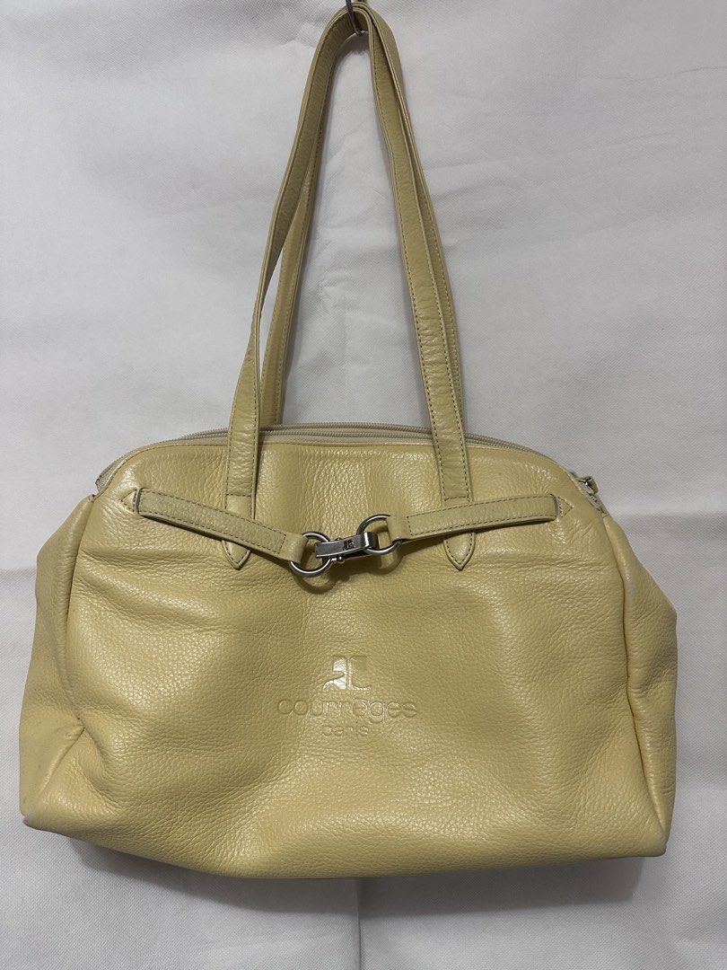 Courreges Paris Leather Shoulder Bag (Category: Luxury Bags & Wallets) located in San Juan City. Submitted by vrgyl (Listing ID 1447020474, Image 1). Description: pls. manage expectations, preloved item with signs of discoloration and rubs on corners of bag - Light yellow leather shoulder bag from Courreges Paris - Features a secure zip closure and a stylish front clasp detail - Interior zip pocket with a small, unnoticeable stain - Some signs of