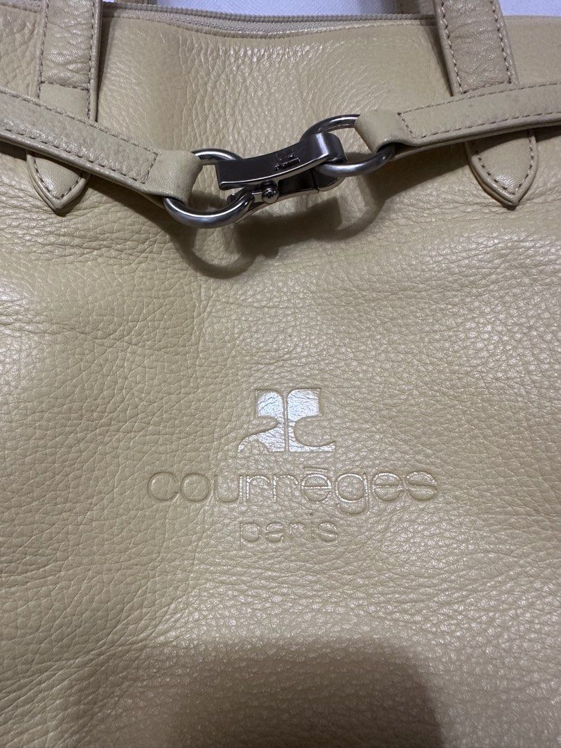 Courreges Paris Leather Shoulder Bag (Category: Luxury Bags & Wallets) located in San Juan City. Submitted by vrgyl (Listing ID 1447020474, Image 2). Description: pls. manage expectations, preloved item with signs of discoloration and rubs on corners of bag - Light yellow leather shoulder bag from Courreges Paris - Features a secure zip closure and a stylish front clasp detail - Interior zip pocket with a small, unnoticeable stain - Some signs of