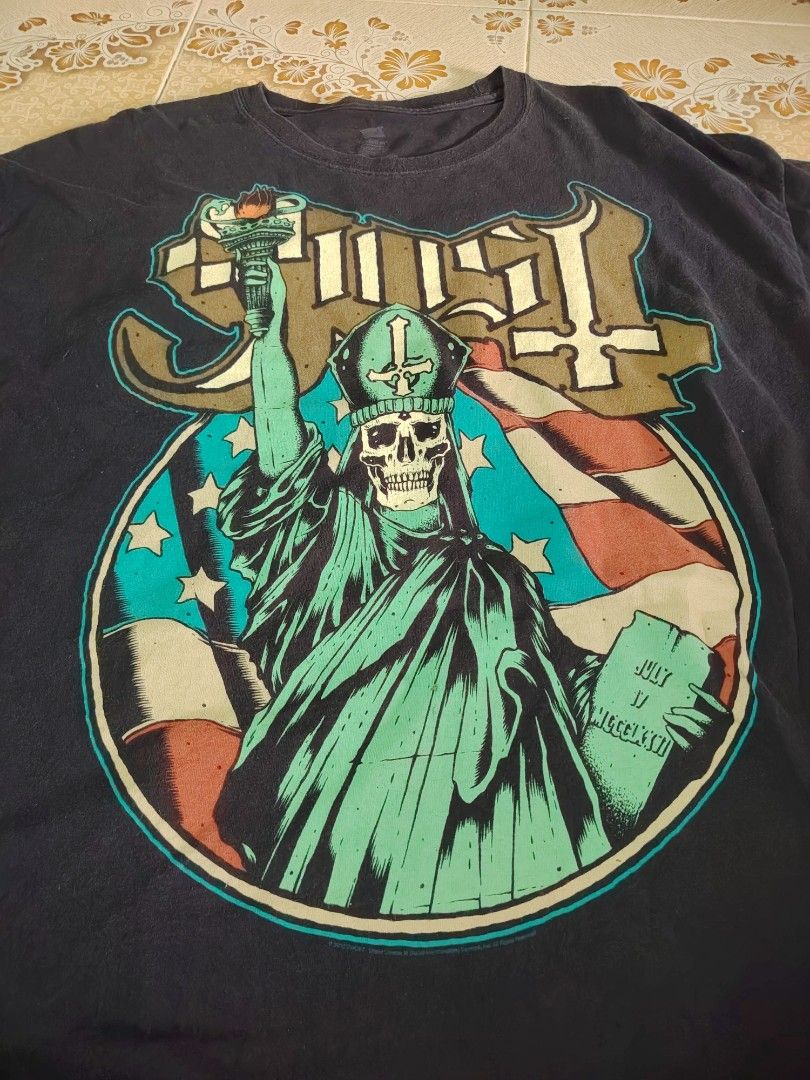 Ghost Band T-Shirt Statue of Liberty Design (Category: Tshirts & Polo Shirts) located in Kuala Lumpur. Submitted by mohdbadhis18171 (Listing ID 1446971606, Image 2). Description: - Black Ghost band t-shirt - Features iconic Statue of Liberty graphic with band logo - Ideal for Ghost fans - Perfect for casual everyday wear - Showcases classic Ghost imagery.