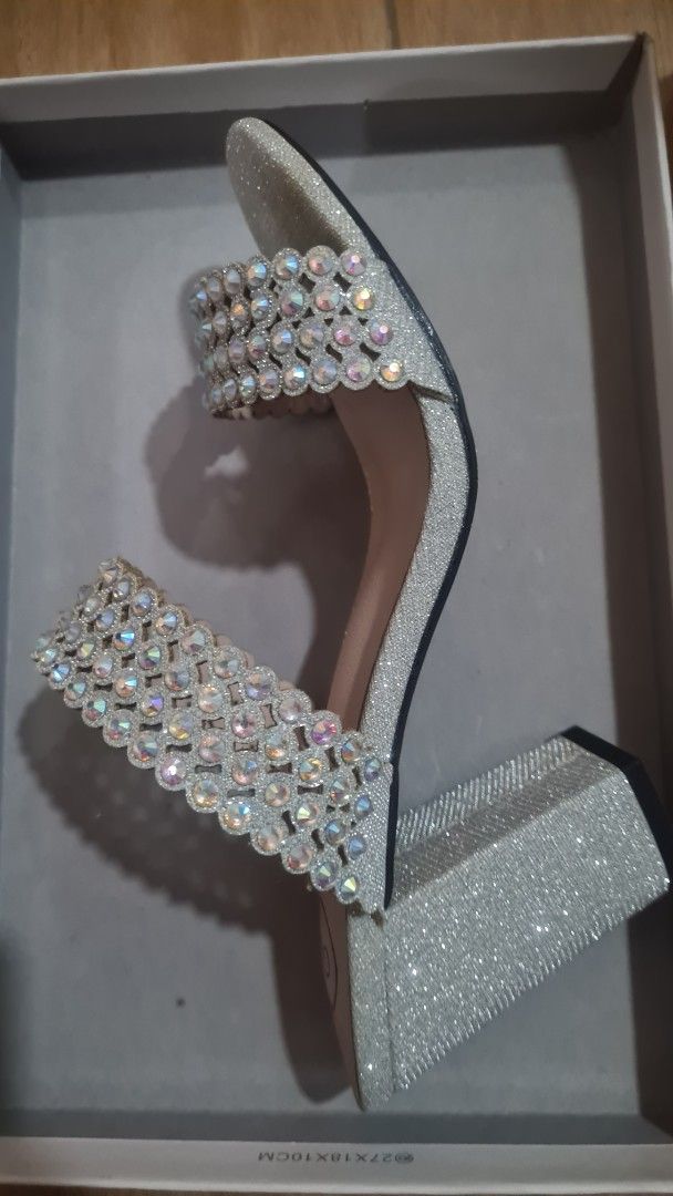 GIBI Silver Glitter Block Heels Size 36 (Category: Heels) located in Paranaque City. Submitted by lorem45 (Listing ID 1447016231, Image 1). Description: - Brand: GIBI - Color: Sparkly Silver - Size: 36 - Embellishments: Sequence stones on straps and glittered heel - Heel Type: Chunky block heel for stability - Condition: Comes in original box.