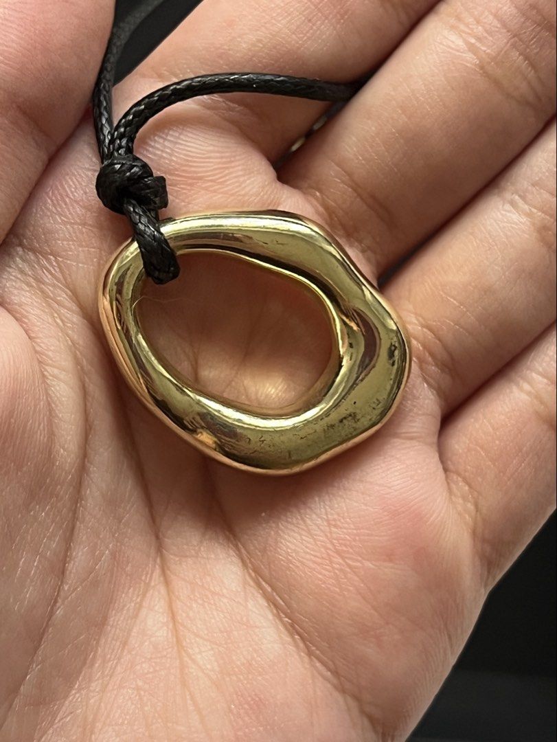 Gold Tone Abstract Pendant Necklace (Category: Necklaces) located in Makati City. Submitted by nat____ (Listing ID 1446988517, Image 3). Description: - Gold tone pendant with an abstract, organic shape. - Adjustable clasp for a perfect fit. - Ideal for everyday wear or to elevate any outfit..