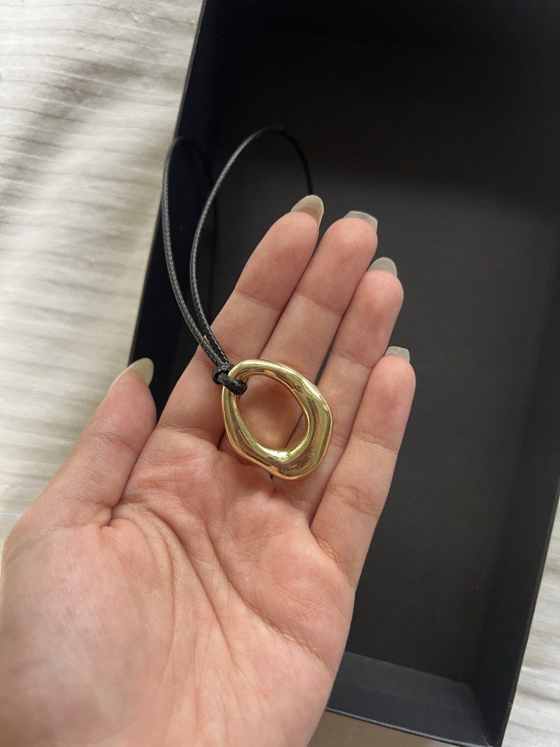 Gold Tone Abstract Pendant Necklace (Category: Necklaces) located in Makati City. Submitted by nat____ (Listing ID 1446988517, Image 2). Description: - Gold tone pendant with an abstract, organic shape. - Adjustable clasp for a perfect fit. - Ideal for everyday wear or to elevate any outfit..