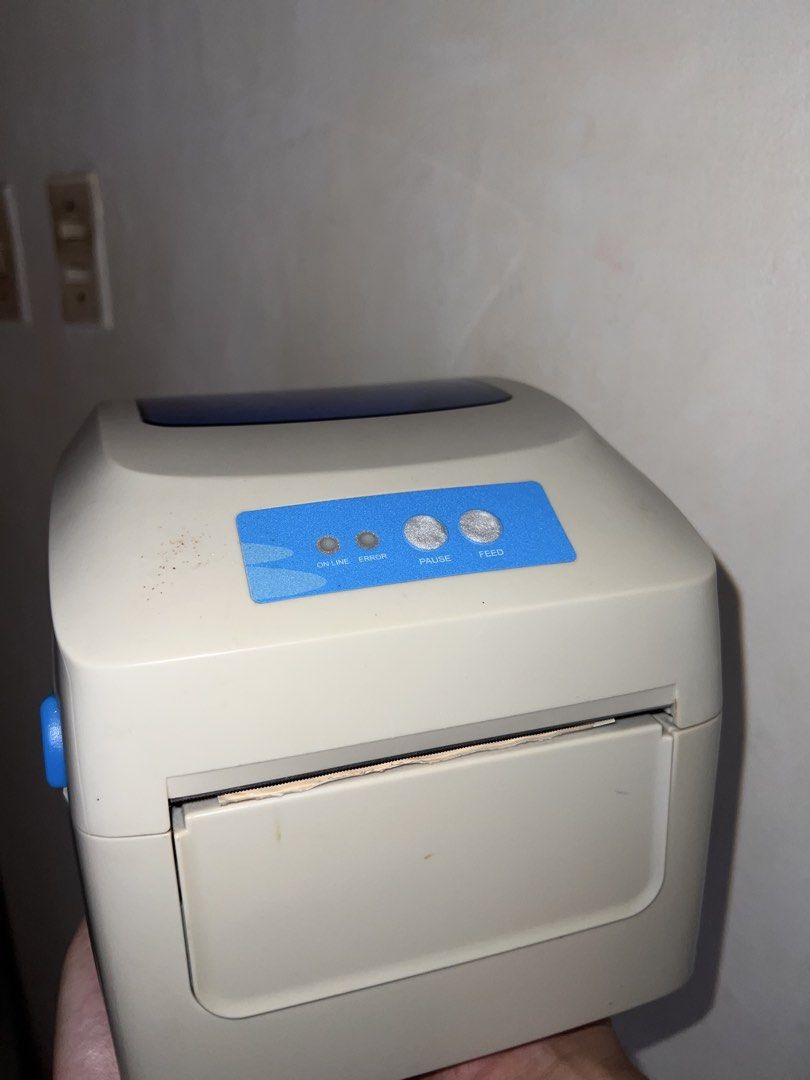 Gprinter waybill printer with j&t express rolls (Category: Printers, Scanners & Copiers) located in Marilao. Submitted by angelthangsxoxo (Listing ID 1446984418, Image 2). Description: -Includes a roll of J&T Express labels. -Has ON LINE, ERROR, PAUSE, and FEED buttons. -Power switch at the back. USB and power ports visible. - NO CABLE/ WIRE INCLUDED.