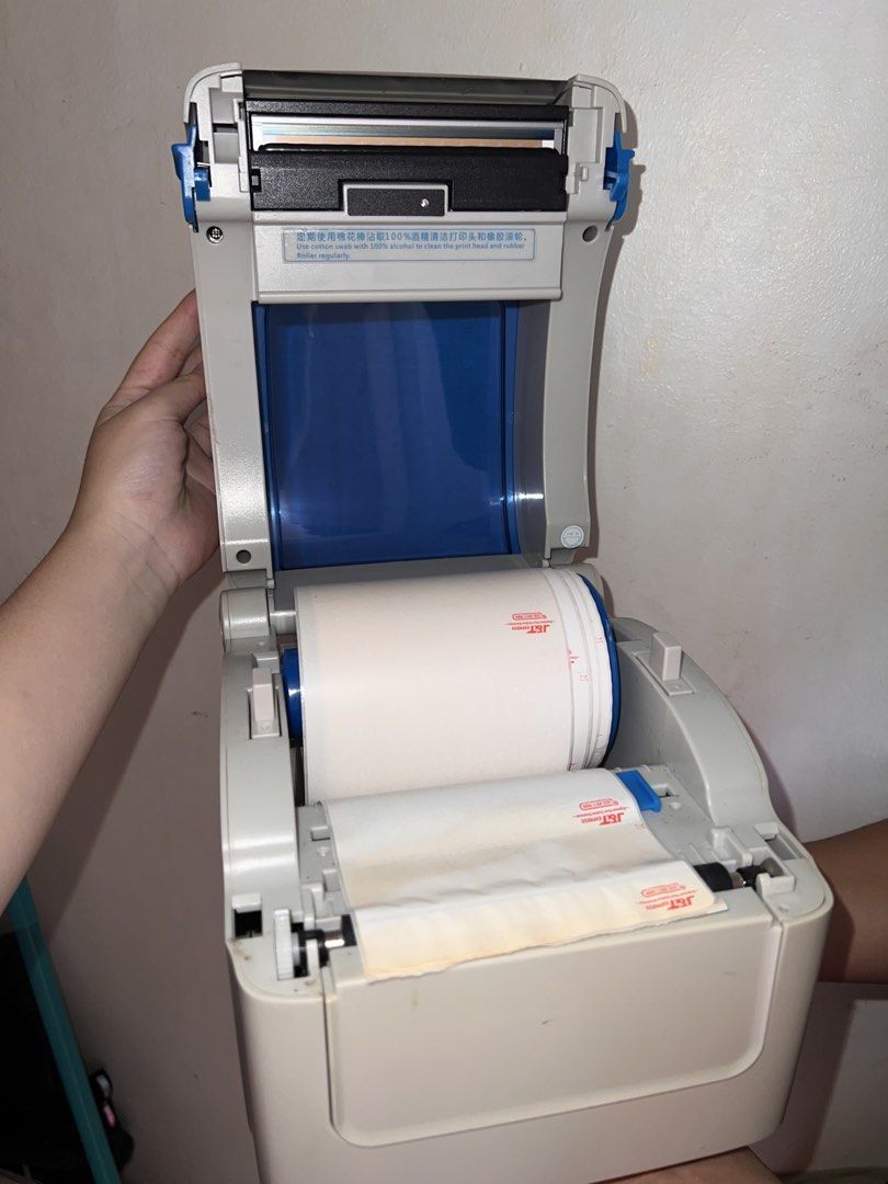 Gprinter waybill printer with j&t express rolls (Category: Printers, Scanners & Copiers) located in Marilao. Submitted by angelthangsxoxo (Listing ID 1446984418, Image 3). Description: -Includes a roll of J&T Express labels. -Has ON LINE, ERROR, PAUSE, and FEED buttons. -Power switch at the back. USB and power ports visible. - NO CABLE/ WIRE INCLUDED.