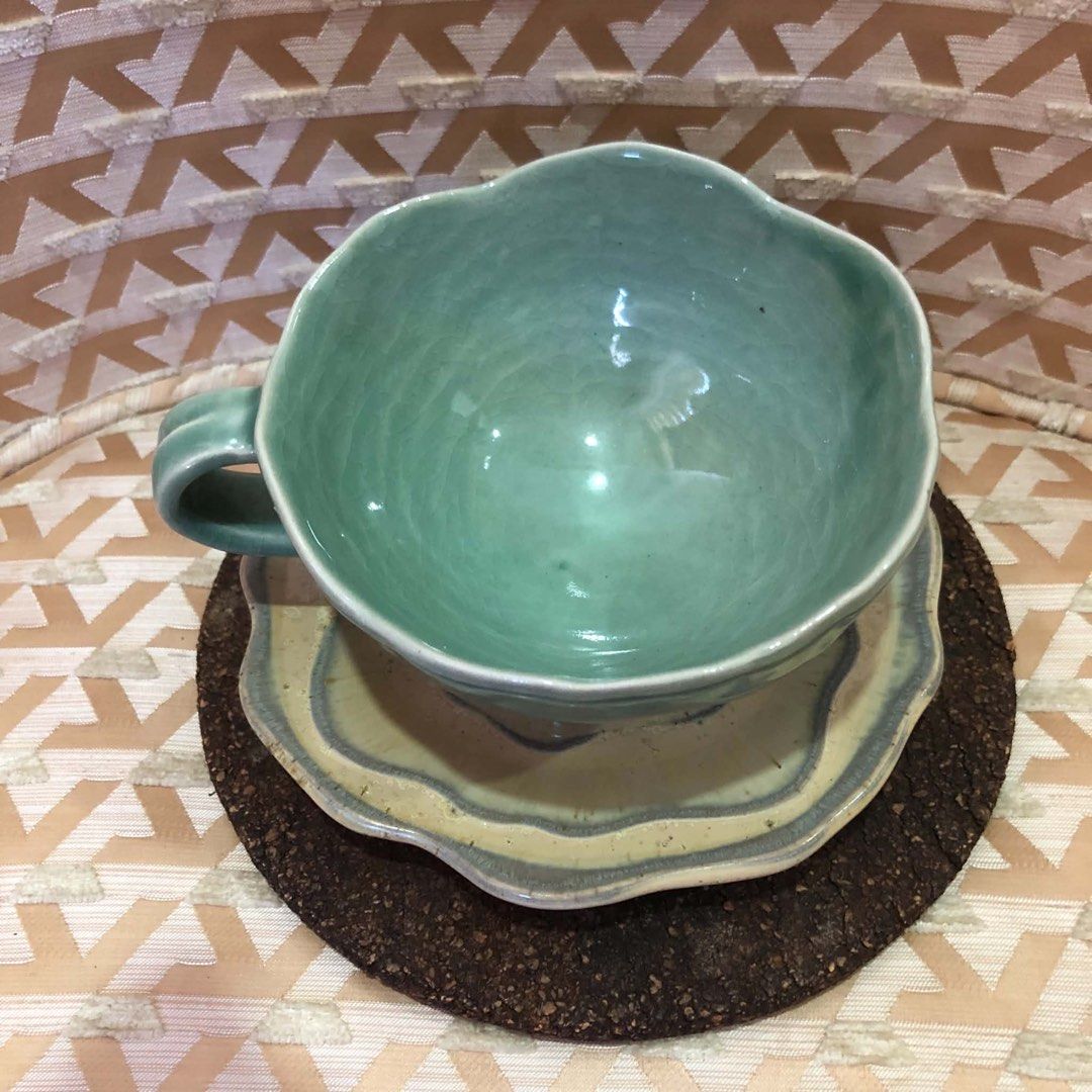 Handmade Ceramic Tea Cup and Saucer Set (Category: Coffee & Tea Tableware) located in Davao. Submitted by giftopia (Listing ID 1447024609, Image 3). Description: - Beautiful handmade ceramic tea cup and saucer - Unique wavy edge design - Cup features a lovely seafoam green glaze - Ideal for morning tea or coffee .