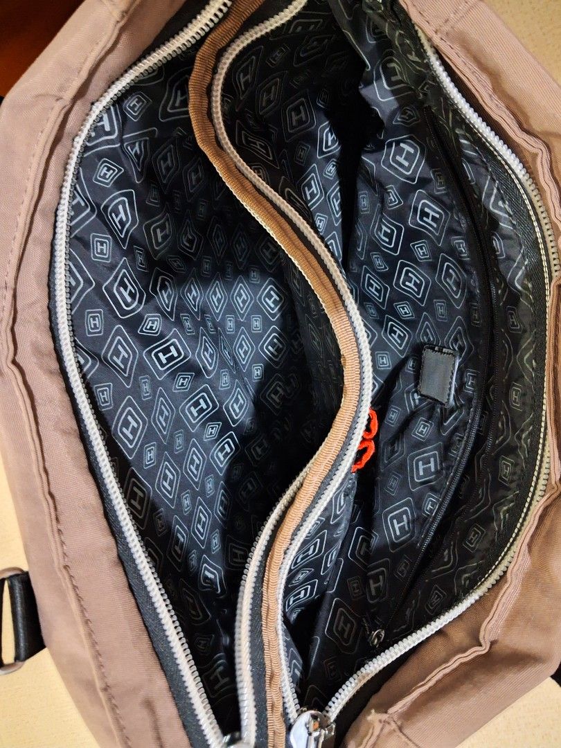 Hedgren Brown Nylon Tote Bag (Category: Tote Bags) located in Angeles City. Submitted by anneps (Listing ID 1446986708, Image 2). Description: - Brand: Hedgren - Color: Brown - Type: Tote Bag - Material: Durable Nylon - Features: Multiple interior and exterior pockets - Zippers: Work well - Straps: Adjustable - Ideal for: Everyday use or travel.