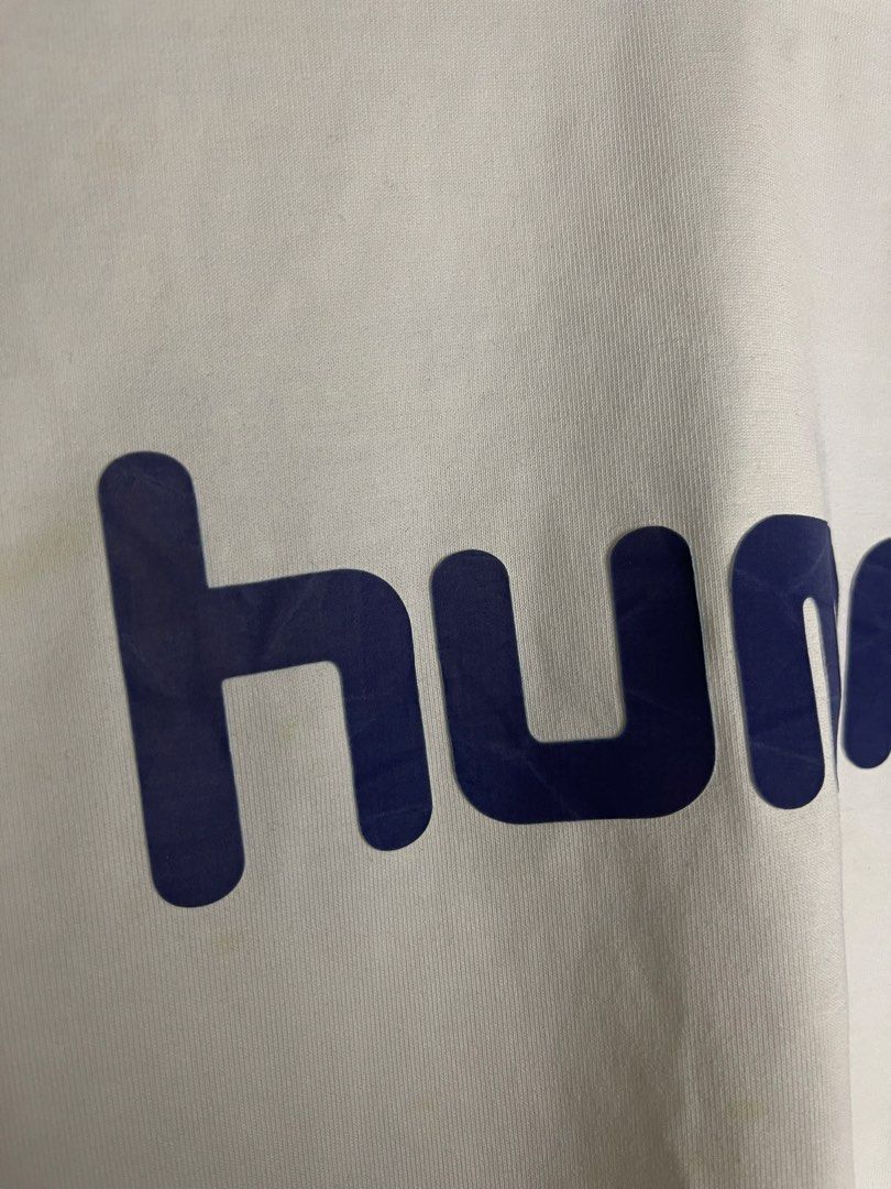 Hummel White T-Shirt with Blue Logo (Category: Tshirts & Polo Shirts ) located in Manila. Submitted by andrada_jamie (Listing ID 1446994903, Image 3). Description: 28.5x23.5 - White Hummel t-shirt - Blue Hummel logo across the chest - Minor marks present (please check photos) - Perfect for casual everyday wear.