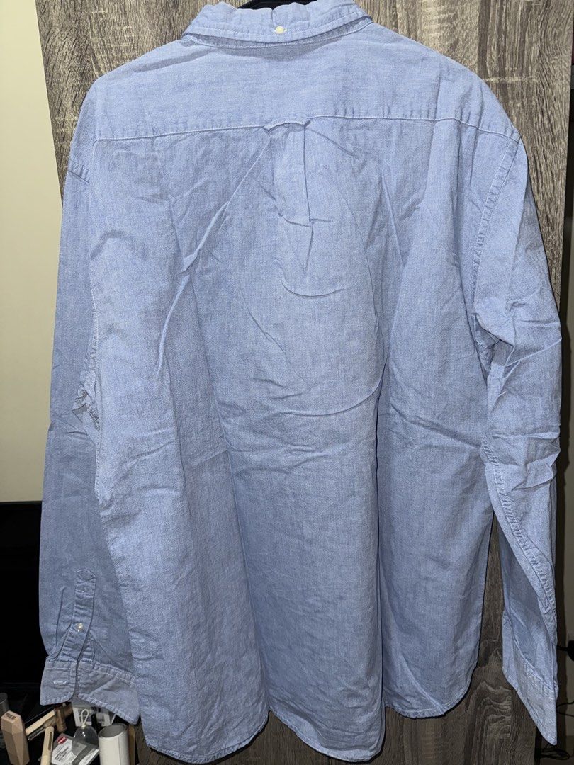 J. Crew Blue Button Down Long Sleeve Shirt XL (Category: Tshirts & Polo Shirts ) located in Mandaluyong City. Submitted by getamplifiednow (Listing ID 1446940499, Image 3). Description: - Classic J. Crew blue button-down shirt - Size: XL - Material: 100% Cotton - Features: Long sleeves, collared - Style: Versatile for casual or smart-casual looks - Easy to pair with jeans or chinos.