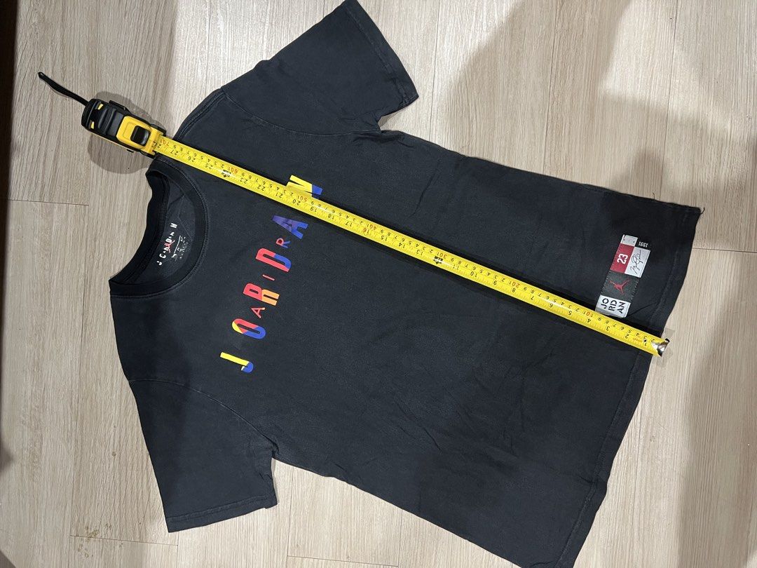 Jordan 23 Graphic T-Shirt (Category: Tshirts & Polo Shirts ) located in Pasay City. Submitted by enchonge (Listing ID 1447054570, Image 2). Description: - Black Jordan t-shirt - Colorful "JO RDAN" graphic on front - "23" graphic on back - Short sleeves - Crew neck - Measurements available in photos - Ideal for any Jordan enthusiast.