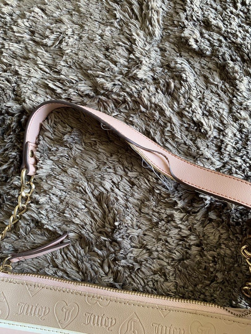 Juicy Couture Shoulder Bag Pink Beige Monogram (Category: Shoulder Bags) located in Quezon City. Submitted by jergaragesale (Listing ID 1446927123, Image 2). Description: - Used Pink and beige Juicy Couture shoulder bag - All-over JC monogram pattern - Zipper closure - Adorable Y2K aesthetic - It has minimal flaw, please see second photo .