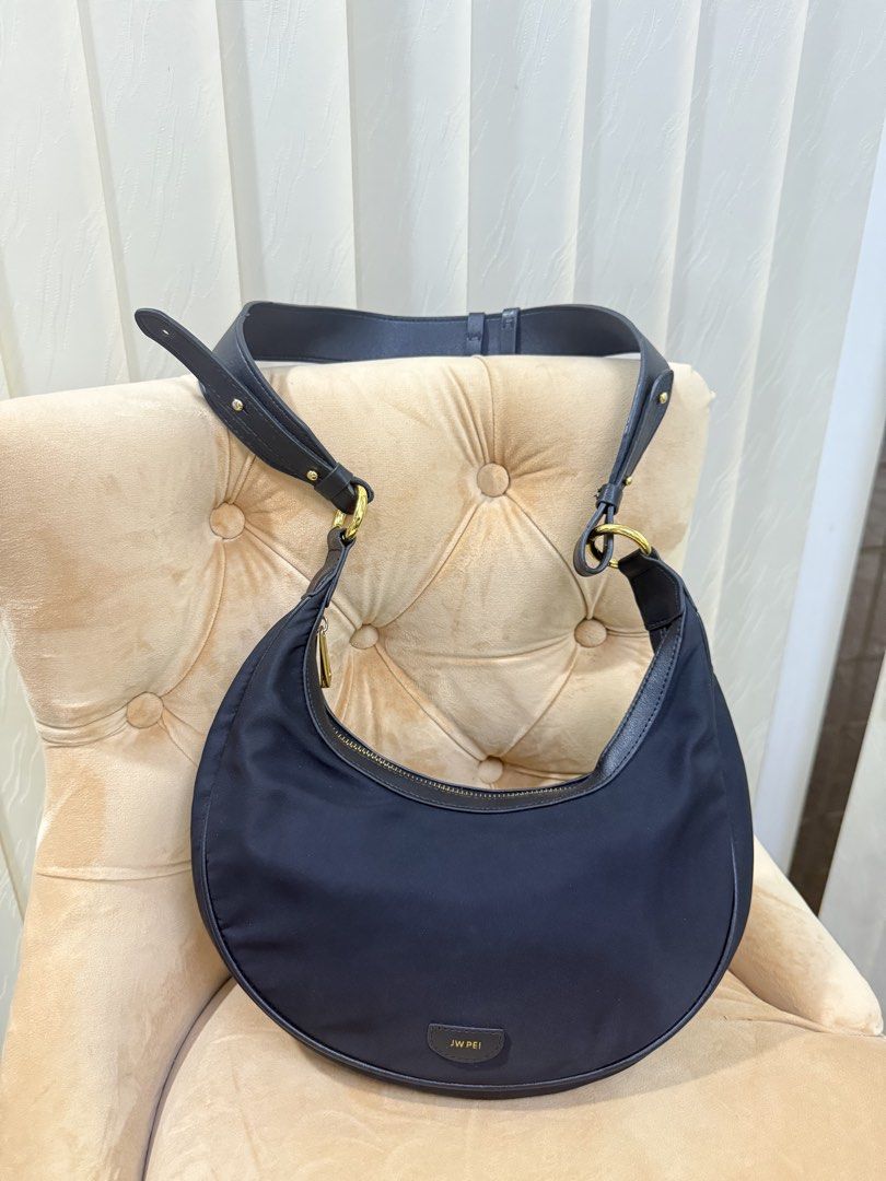 JW PEI CARLY SHOULDER BAG (Category: Luxury Bags & Wallets) located in Angeles City. Submitted by bagpriceinfiniteluck (Listing ID 1447015161, Image 1). Description: Jw pei CARLY SHOULDER BAG crafted from durable Nylon and features gold toned hardware This model is designed as a crescent or saddle shaped bag Includes an adjustsble shoulder strap for versatile carrying options This bag is made from sustainable materials using recycled plastic from